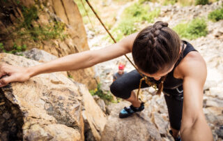 Young Climbers Rock Climbing In Okanagan